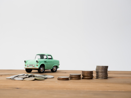 Money coins stack growing with red house on wood background. Business growth investment and financial concept ideas.Real estate investment. House and coins on table.Save money with stack coin.Invest money for buy car.の写真素材