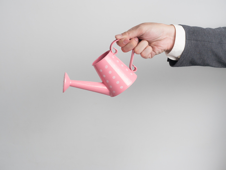 Businessman confirm project .Idea business on white background.he  watering something for business growth.の写真素材