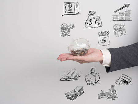 Businessman confirm project .Idea business on white background.he  hold piggy bank for invest money for business.drawing money on backgroung cartoon styleの写真素材