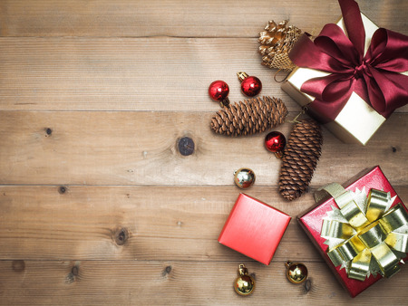 Christmas decorations, giftbox wooden background. Empty space for designer text.の写真素材