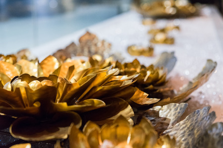 Lotus flower metal carving with gold paint.sculpture golden lotus .の写真素材