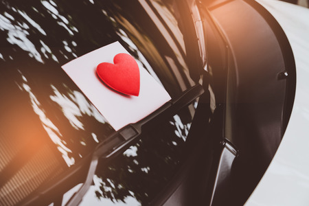 love letter heart on a sticky note under a windshield .vintage  color styleの写真素材