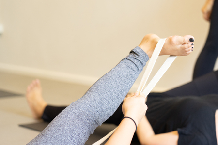 Young fat  woman practicing yoga with namaste behind the back.working out, wearing sportswear. and relax.の写真素材