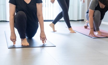 Young fat  woman practicing yoga with namaste behind the back.working out, wearing sportswear. and relax.の写真素材