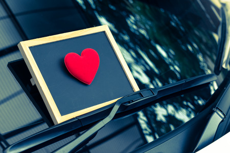 love letter heart on a sticky note under a windshield .vintage  color styleの写真素材