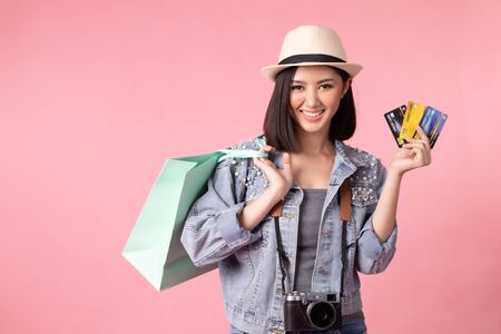 Tourist woman in summer casual clothes. Asian Smiling woman. Passenger traveling abroad to travel on...