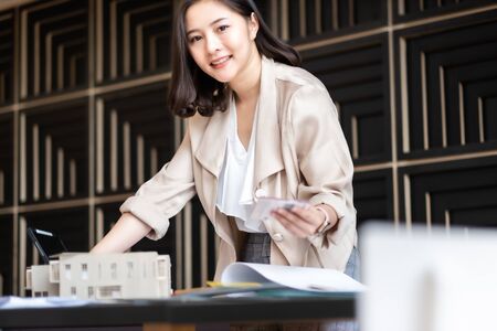 Architect or interior designer working with material sample board in showroom. Business of Real...
