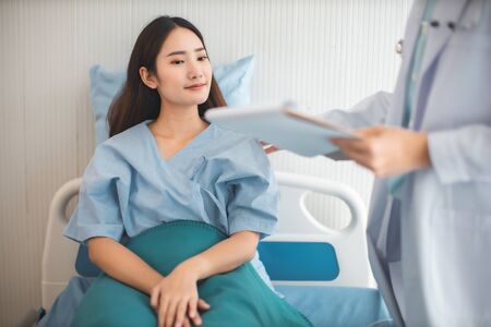Medicine and health care concept.  Asian doctor is taking care patient woman in hospital.doctor or...