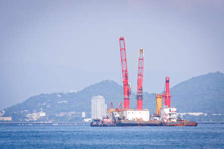 Cargo ship docking at coastal working in port.の写真素材