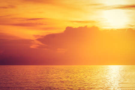 Silhouette view of water with golden light background.の写真素材