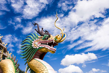 Chiang Rai, Thailand - January 1, 2016: Dragon Head Statue At Wat Huai Pla Kang With Blue Sky Background.の写真素材