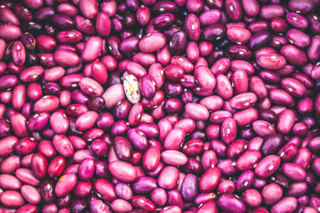 Close-Up View Of Red Beans Scattered Beans Around With Beans Background. (View From Above)の写真素材