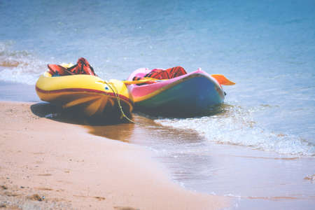 Colorful Image Of Kayaks On Sandy Beach.