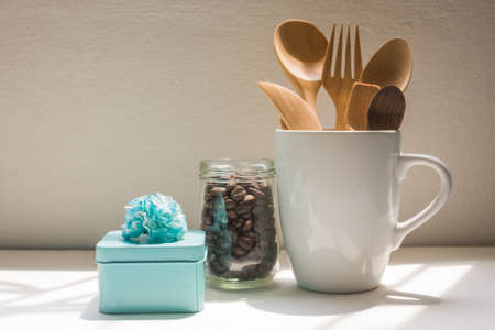 Roasted Coffee Beans In Glass And Spoon In Cup On White Background.の写真素材