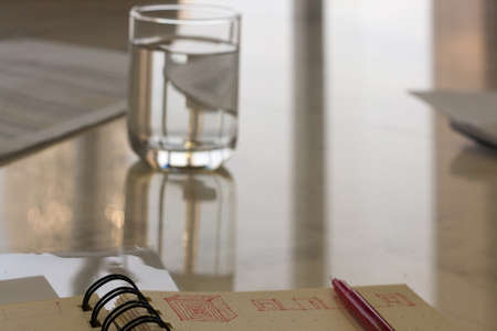 Stationery And Glass Of Water On The Table In Office Worker.の写真素材