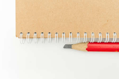 Blank Stationery Book And Red Pencil Isolated On White.