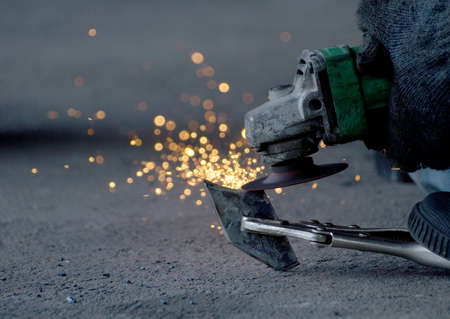 Worker Hands Of Labour Working By Tool Cutting Steel In Workshop.の写真素材