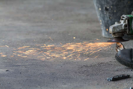 Worker Hands Of Labour Working By Tool Cutting Steel In Workshop.
