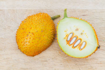 Gac Fruit Or Baby Jackfruit With Half Cross Section On Wooden Background.の写真素材