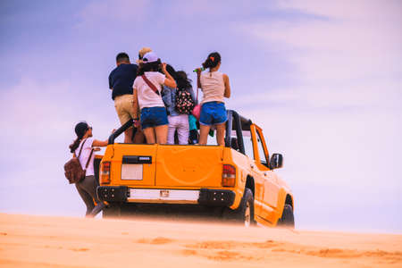 Mui Ne, Vietnam - May 26, 2017: Unidentified People On Off Roads Car In Sunny Day With Blue Sky On Sand Dune (White Desert) In Mui Ne Vietnam.のeditorial素材