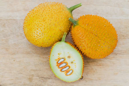 Gac Fruit Or Baby Jackfruit With Half Cross Section On Wooden Background.の写真素材