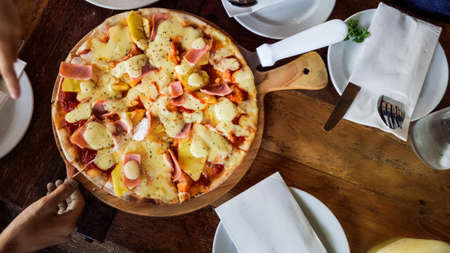 Meat Hawaiian Pizza Fast Food On Wooden Backgroundの写真素材