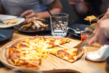 Meat Pizza Fast Food On Wooden Plate Background.の写真素材