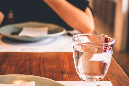 Glass Of Water On The Table In Office Worker.の写真素材
