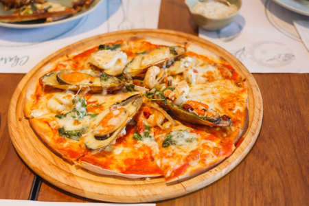 Meat Pizza Fast Food On Wooden Plate Background.の写真素材