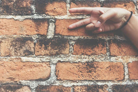 Close-Up Of Surface Old Brick Wall Backdrop Hand Focus.