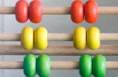 Group Of Multicolor Abacus On Row Helping School Children Understanding Maths In Classroom.