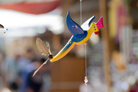 Close-Up Of Hand Carved Bird Wooden Mobile.の写真素材