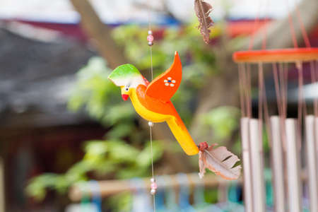 Close-Up Of Hand Carved Bird Wooden Mobile.の写真素材