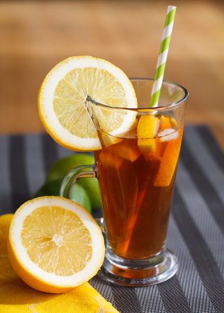 Lemon tea in glass on wooden tableの写真素材