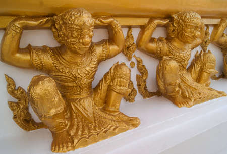 the hanuman statue golden wall art temple in thaiの写真素材