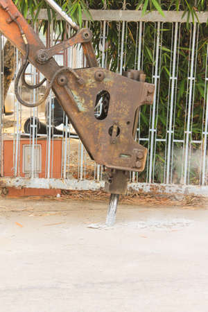 drill concrete road with excavator breaking and drilling