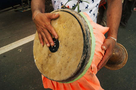 the drummer playing local musical equipment at esan thailandの写真素材