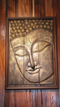 buddha face image on wood wall backgroundのeditorial素材