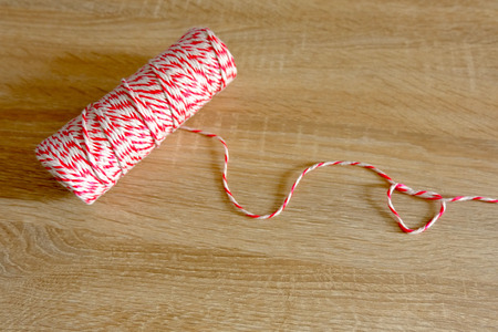Red and white parcel rope roll and heart shapeの写真素材