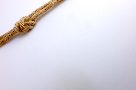 Bundle of jute rope on white backgroundの写真素材