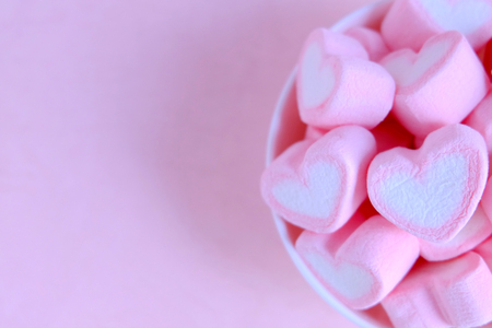 Pink marshmallow background, Heart marshmallow in white cup, Valentine backgroundの写真素材