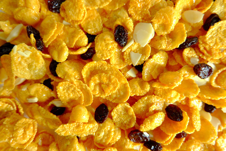 Crispy corn flakes and raisin background