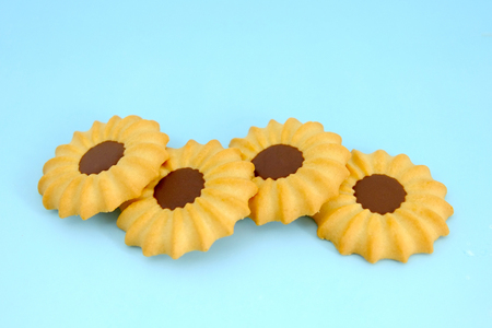 Ground of cookies on blue background, Vanilla cookies, Chocolate cookiesの写真素材