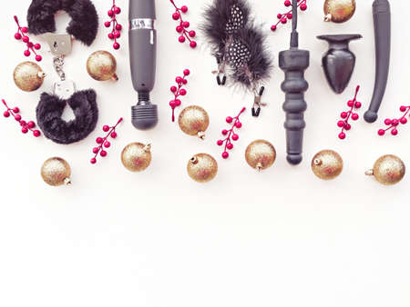 Christmas or New Year background with a variety of toys, golden balls and red berriesの写真素材