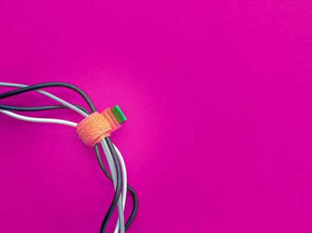 Fastening different wires with Velcro tape. Useful device for home or office. Accurate carrying out of repair work on laying cables for various purposesの写真素材
