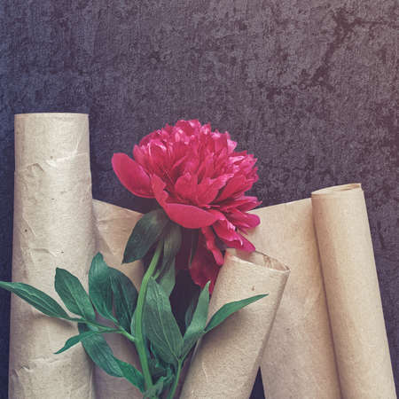 Red peony flower and crafting wrapping paper On the flower petals are water droplets.の写真素材