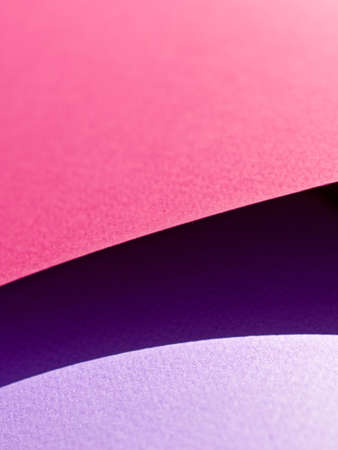 Abstract background made of red and purple sheets of thick paper twisted together. Shallow depth of field.の写真素材