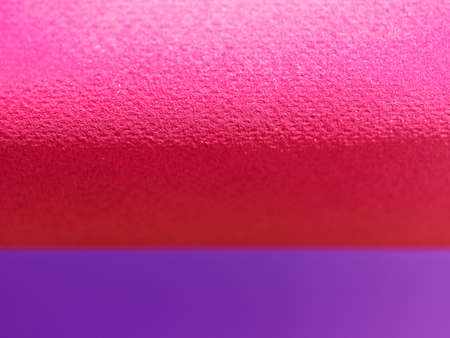 Abstract background made of red and purple sheets of thick paper twisted together. Shallow depth of field.の写真素材
