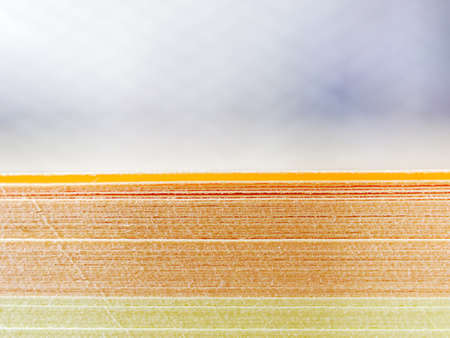 A close view of a stack of colored paper for recordings. Abstract background. Copy space.の写真素材