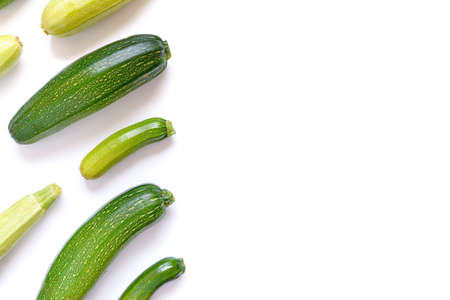 Autumn composition. Pattern from vegetables. Whole ripe zucchini and eggplants are on a white...